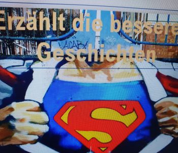 Bild von Superman aus Vortrag von Lena Frischlich mit Aufforderung: Erzählt die besseren Geschichten